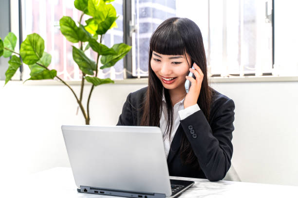 istock Female employee working on a laptop 2152774636