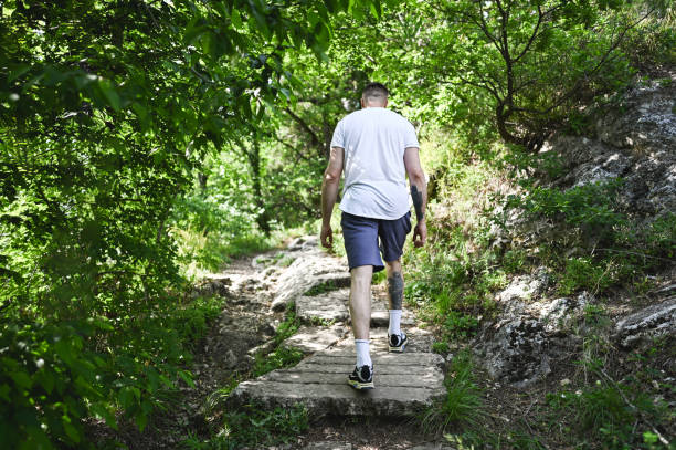 istock Man exercising in woodland. 2152774920