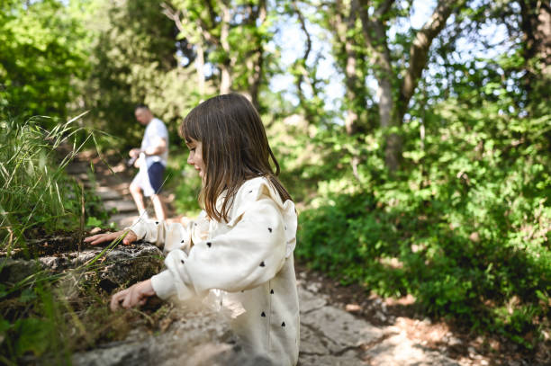 istock Child playing in woodland. 2152775638