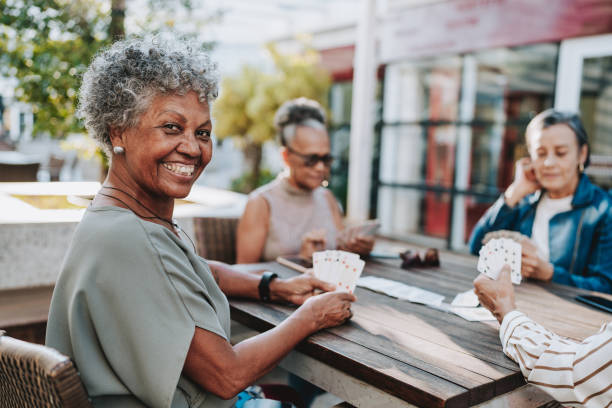 istock women playing cards 2152776680