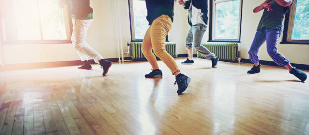 istock Dancer group, feet and hip hop for breakdance with friends to practice for performance or competition. People, team and dancing class to learn together in rehearsal to plan steps and formation 2152777863