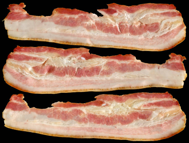 Three Delicious Gourmet Juicy Meaty Pork Belly Bacon Slices Isolated On Black Background High Resolution Stock Image
