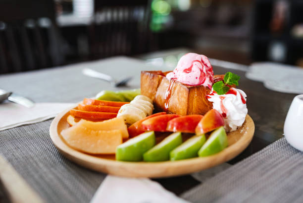 French toast with fruits and whipped cream.