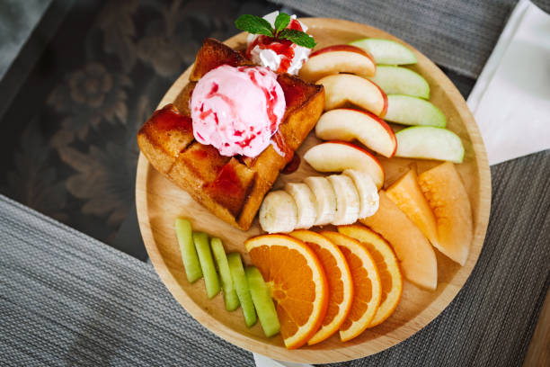 French toast with fruits and whipped cream.