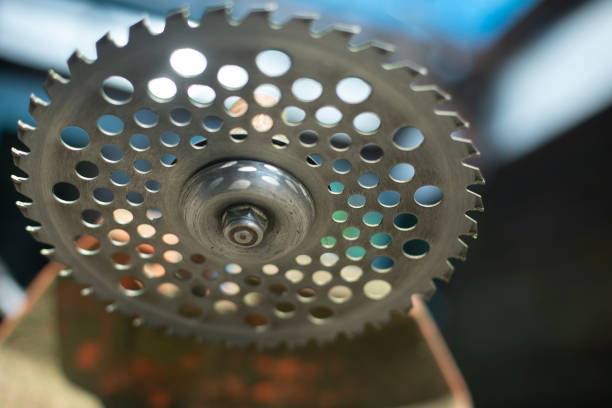 Grass cutting disc. Garden tools for mowing lawn. Sharp steel disc. Saw for work.