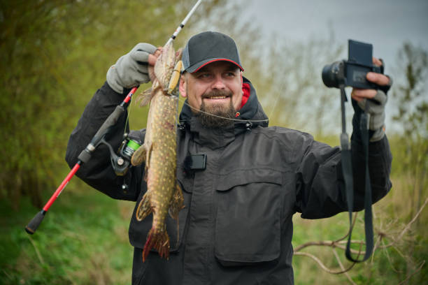 A man holding a fish in his hands