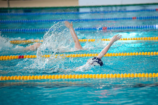 istock Race of backstroke swimmers in the pool 2152784751