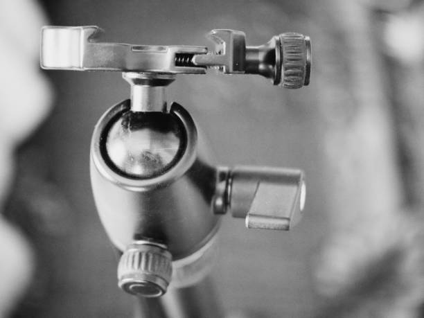 Tripod head for the camera, close-up. A tripod head is the part of a tripod system that attaches the supported device to the tripod legs.