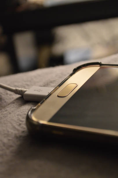A Cell phone plugged into a charger