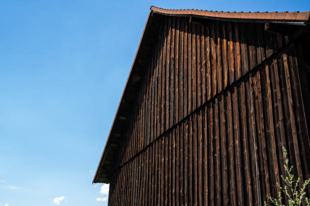 Old brown wooden barn in the countryside