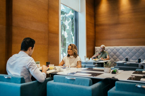 istock Coworkers having breakfast at hotel 2152797651