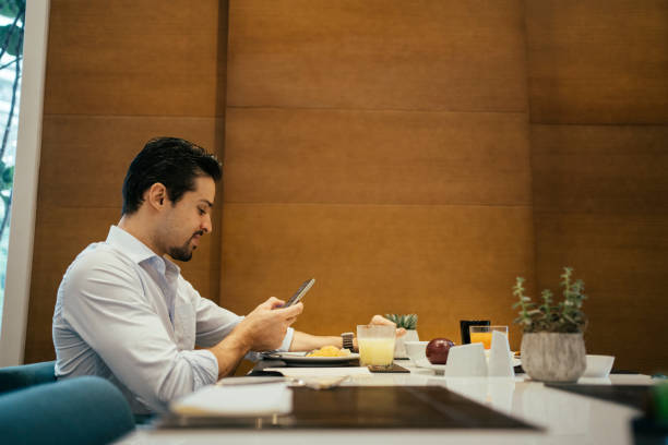 istock Business man having breakfast at hotel 2152797666