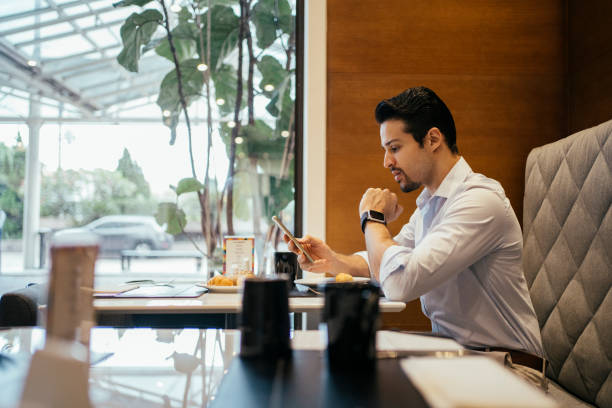 istock Business man having breakfast in hotel 2152797670