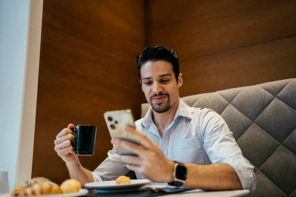 istock Business man having breakfast in hotel 2152797673