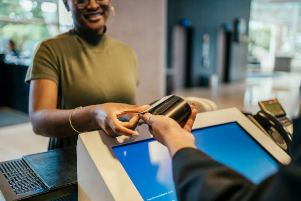 istock Businesswoman making payment at hotel 2152797700