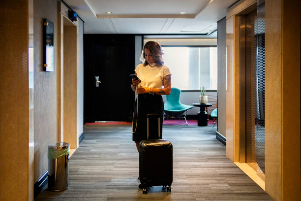istock Businesswoman near hotel elevator 2152797799