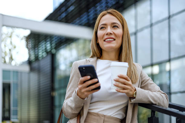 istock Business elegance meets urban pace with coffee and smartphone 2152797969