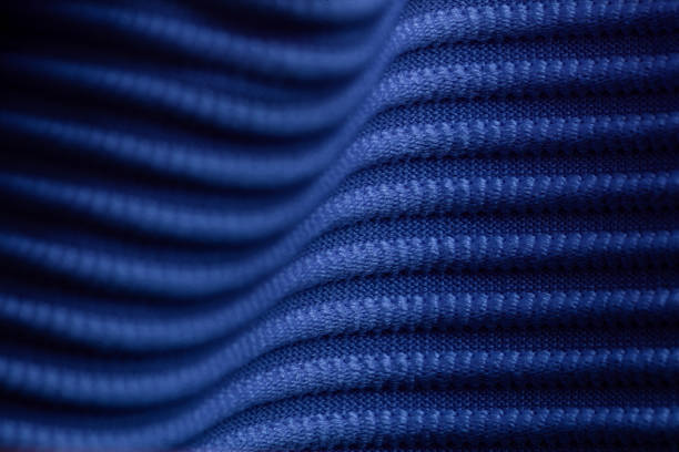 Closeup of blue corduroy cloth as patterned textured background for design purpose