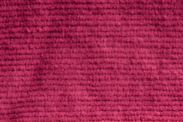 istock Closeup of pink corduroy cloth as patterned textured background 2152801975