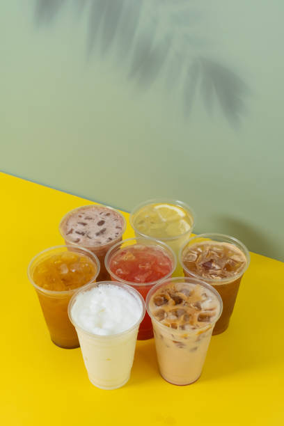 istock Takeaway glasses of summer drinks with ice. Colourful lemonades and coctails angle view 2152802243