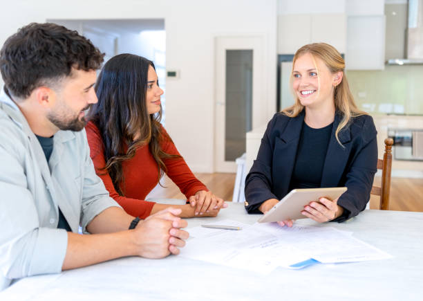 istock Insurance, finance or real estate agent with couple looking through documents. 2152803018