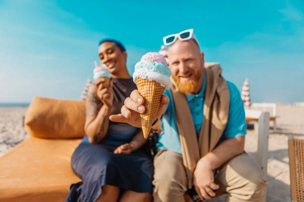 istock Two diverse friends on a beach holiday together 2152803124