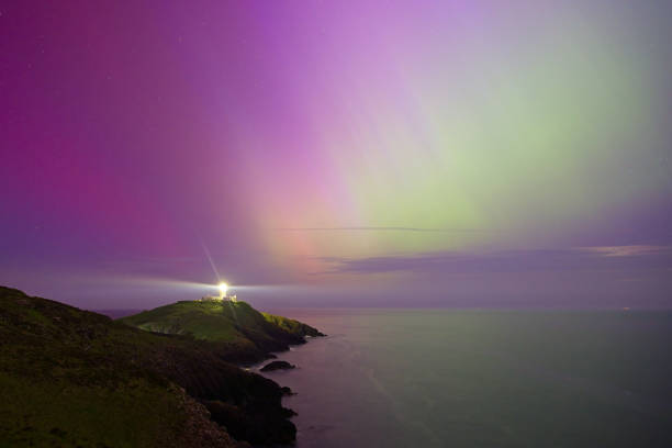 Blackhead Lighthouse high up on the coastal cliffs of Northern Ireland near the town of Whitehead