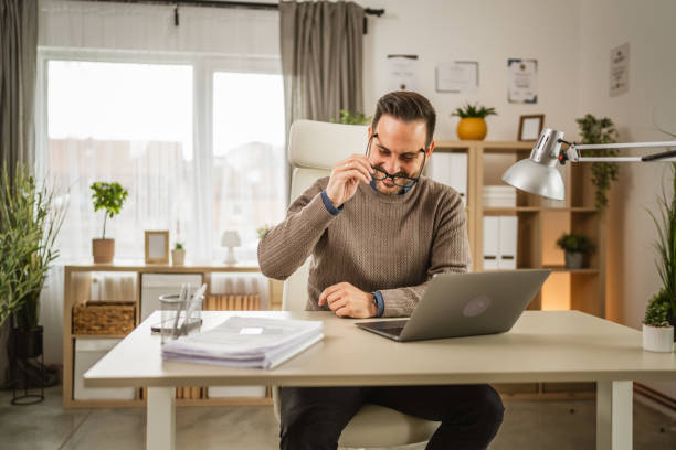 istock One adult man sit at office put his eyeglasses and prepare for workday 2152803857