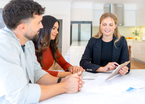 istock Insurance, finance or real estate agent with couple looking through documents. 2152803882