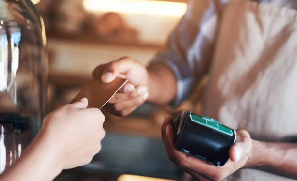 istock Hands, pos and credit card to buy at cafe, ecommerce and transaction on electronic machine. Coffee shop, digital scanner and person for tap purchase, internet currency and online service for b2c 2152804747