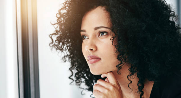 istock Woman, thinking and window with ambition at office for planning, idea or vision for morning or design. Closeup of young female person or creative employee in wonder or thought for business or startup 2152804809