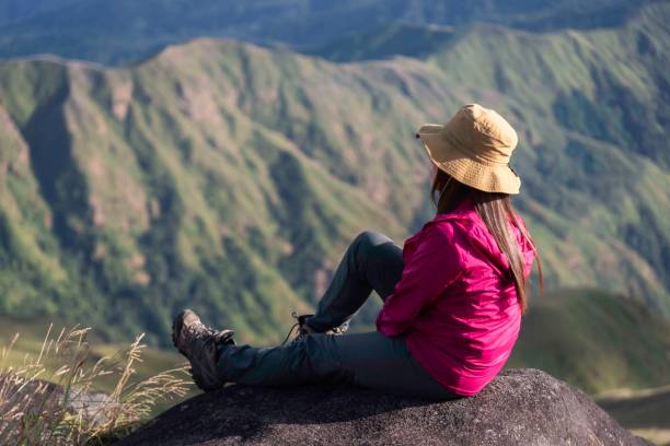 istock Hiker asian woman backpack walking trail activity camping outdoors and People exploring forest green natural capturing beauty nature outdoor. 2152809992