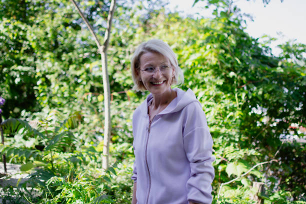 istock mature blonde woman explores nature 2152810024