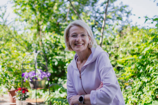 istock mature blonde woman explores nature 2152810027