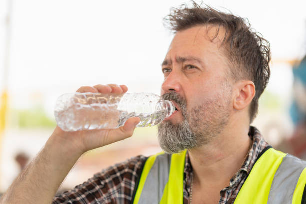 istock Caucasian engineer man drinking water at the precast factory site, Worker man drinking water at construction site 2152813331
