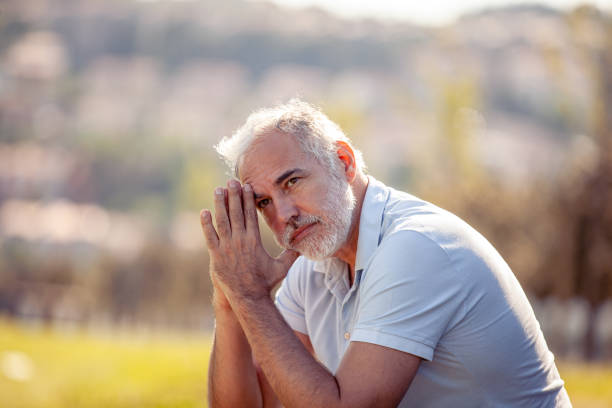 istock Pensive middle age man portrait outdoors looking at view 2152814608