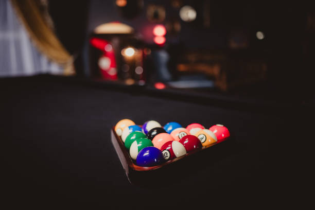 istock Pool table and balls in a dark nightclub 2152815950