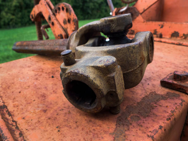 istock Large Metal Rusted Tool Left Outside On Top Of A Red Machine 2152816287