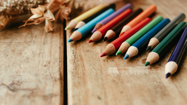 istock Colored pencils on a wooden desk. 2152816471