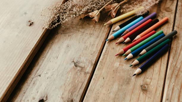 istock Colored pencils on a wooden desk. 2152816472
