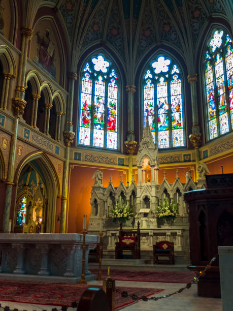 istock Catholic CHurch Alter With Wrap Around Stained Glass 2152819079