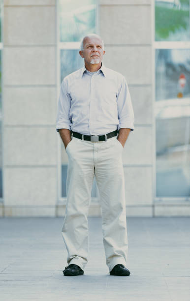 istock Contemplative gaze, modern building behind, light clothes 2152828116