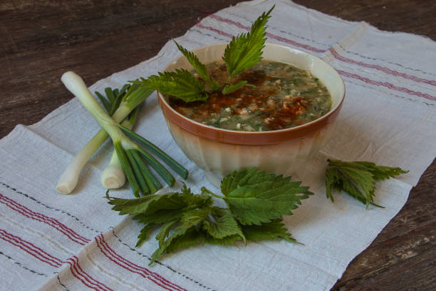 Green nettle soup with eggs and cheese and rice