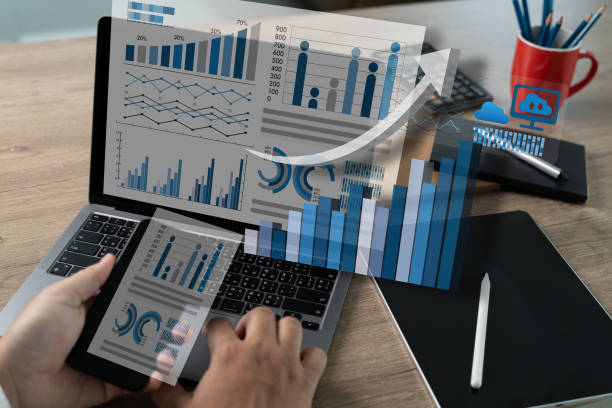 istock Finance, Statistics, and Data Analytics A businessman providing information closes a market research graph. Dashboard and chart digital infographic for statistics and analytics 2152831358
