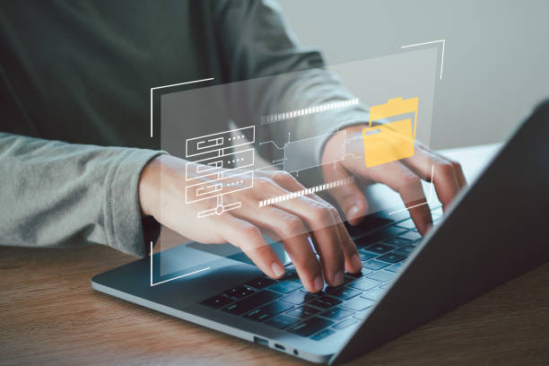 istock Businessman use laptop to download organizational information or documents. cloud storage technology, backup cyber security system. 2152831420