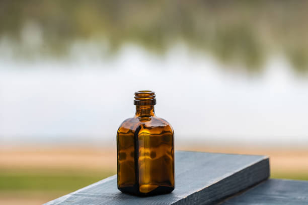 Vintage bottle for medicines or potion on the desk. Copy space.