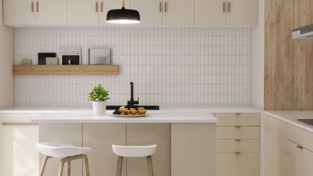 istock Modern, luxury kitchen with ivory cream built in cabinet, cupboard, kitchen island and white tile splashback in sunlight from glass door 2152832315