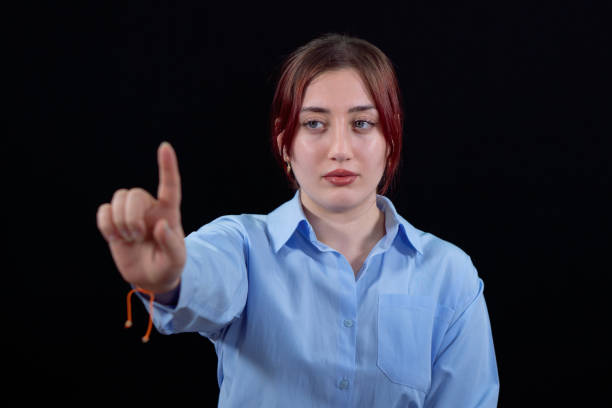Young woman touching digital screen, Success is right at your fingertips.
