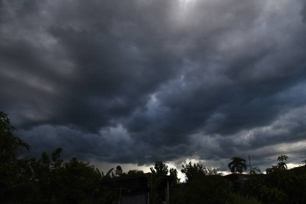 istock Dramatic dark storm rain clouds black sky background. Dark thunderstorm clouds rainny atmosphere. Meteorology danger windstorm disasters climate. Dark cloudscape storm disaster gloomy gray cloud sky 2152833289