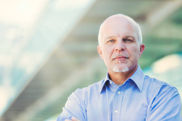 istock Senior professional exudes confidence at modern building 2152837447
